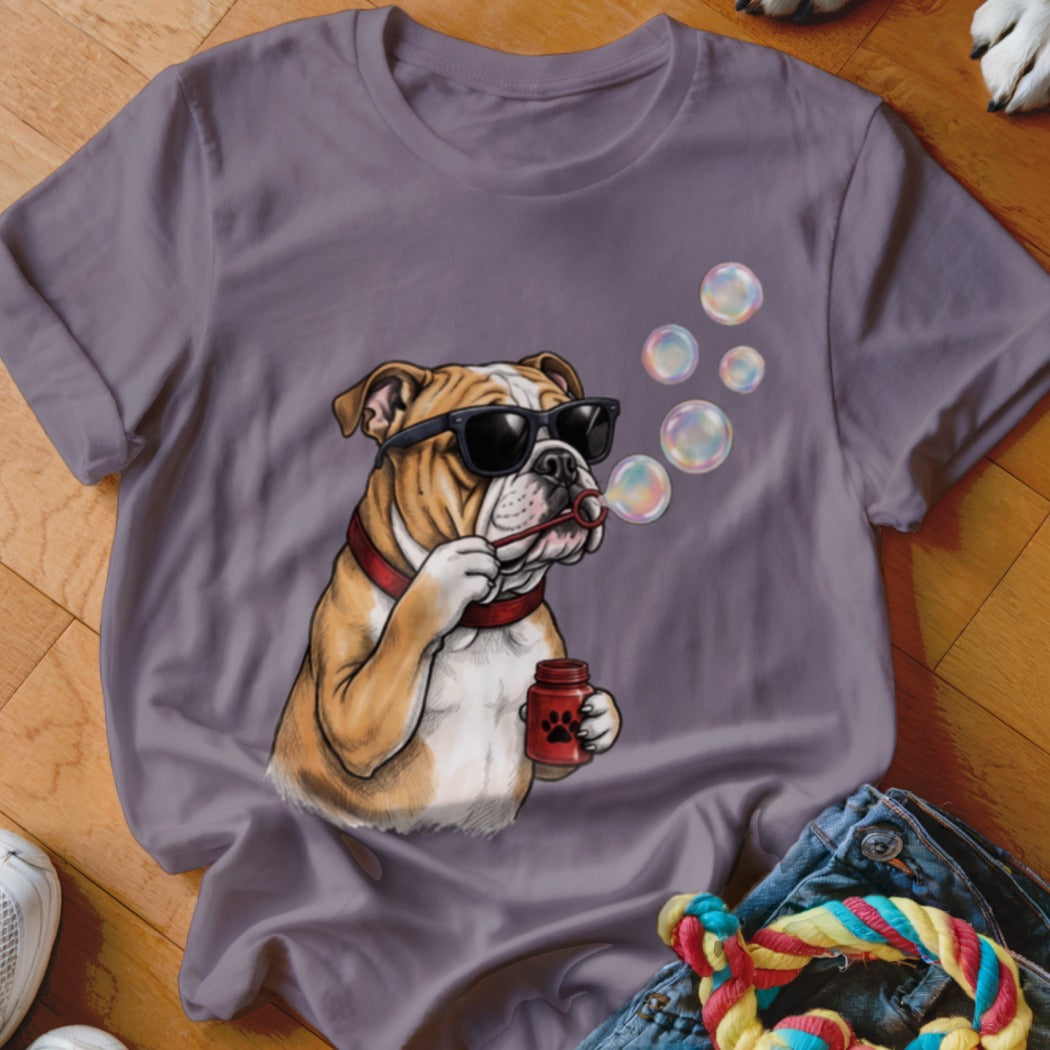Purple t-shirt featuring a graphic of a bulldog wearing sunglasses and blowing soap bubbles.