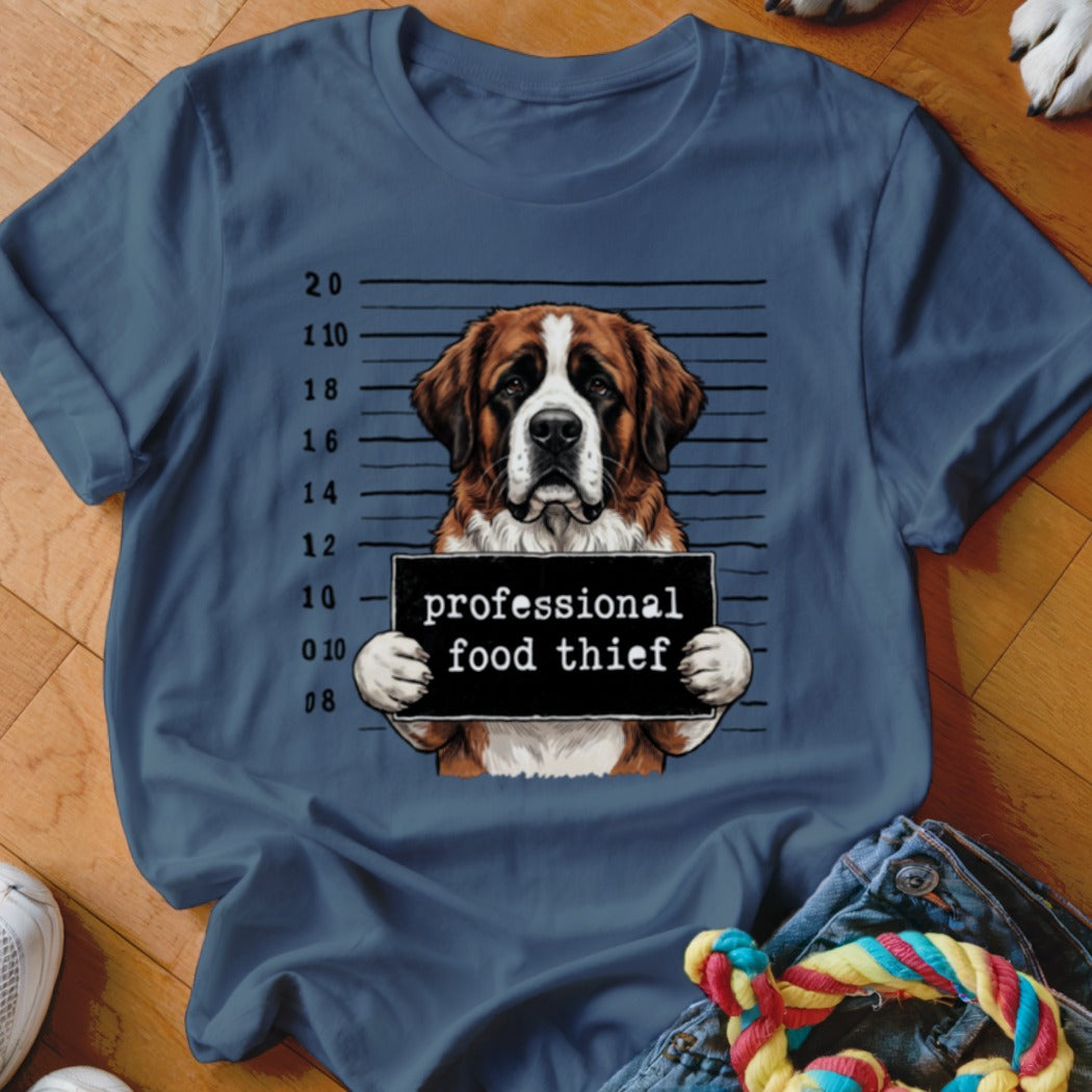 St. Bernard dog mugshot graphic with "professional food thief" sign on navy t-shirt.