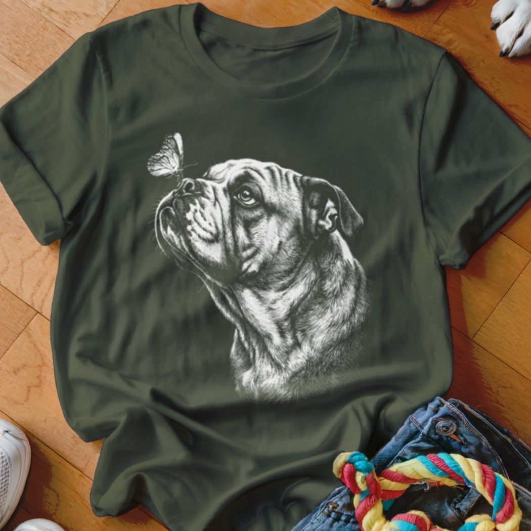 Dark green crewneck t-shirt featuring a white sketch graphic of an English bulldog looking at a butterfly.