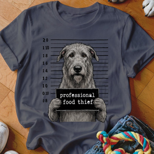 Irish Wolfhound mugshot with "professional food thief" sign on a dark grey t-shirt.