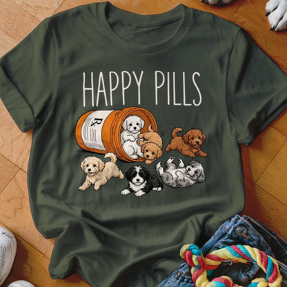 Dark green t-shirt with "HAPPY PILLS" text above a pill bottle spilling out playful puppies.