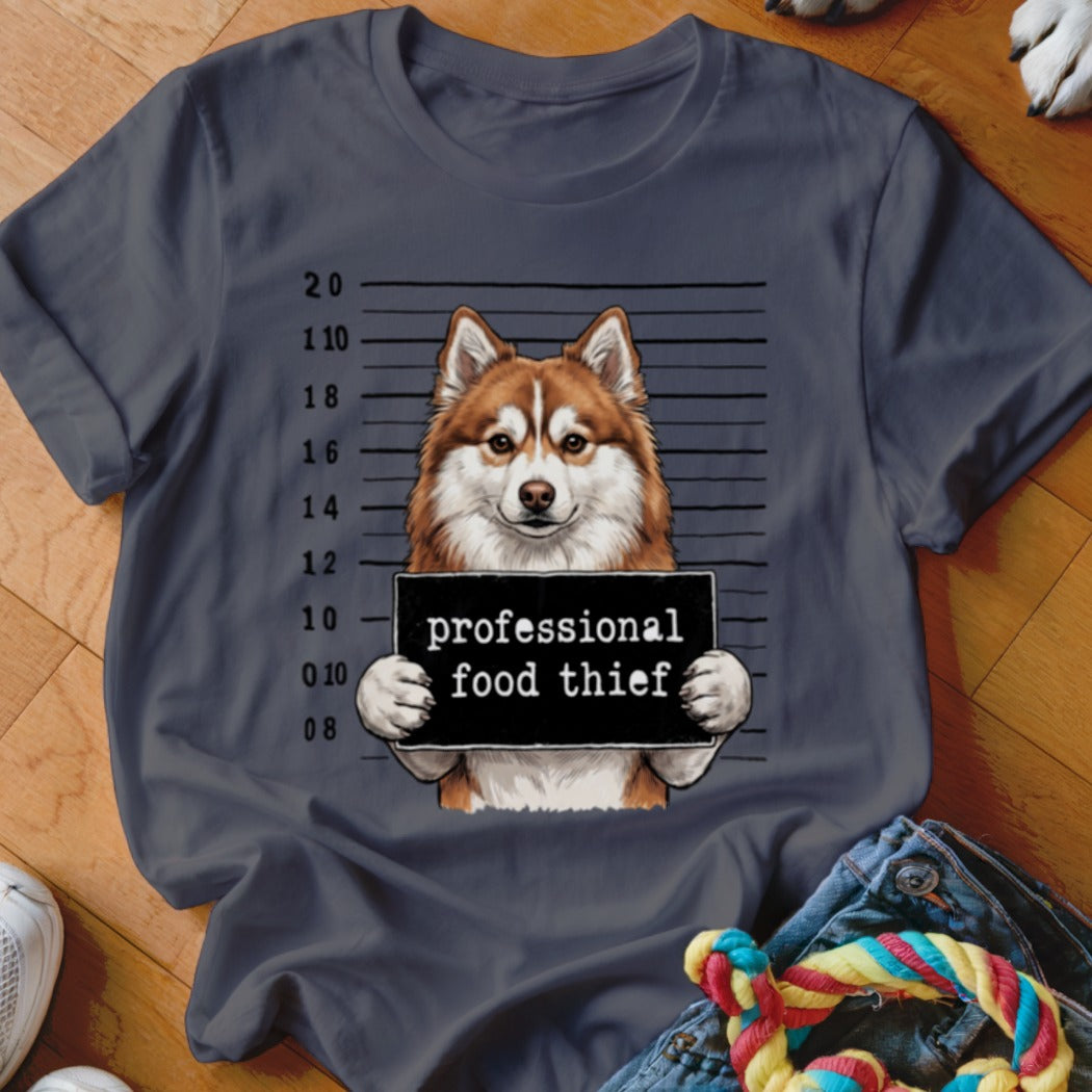 Husky dog mugshot with sign reading "professional food thief".