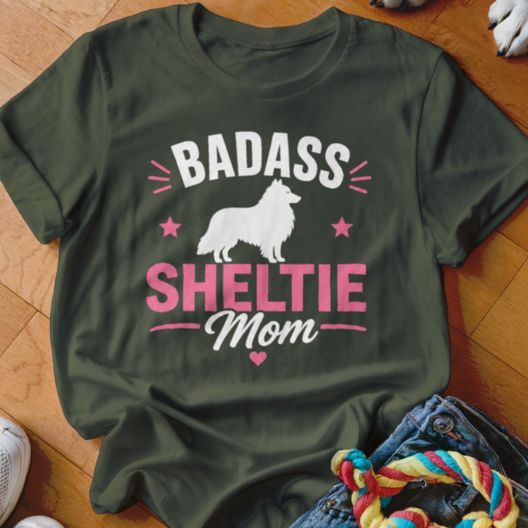 Dark green t-shirt with "Badass Sheltie Mom" text and a white Sheltie silhouette.