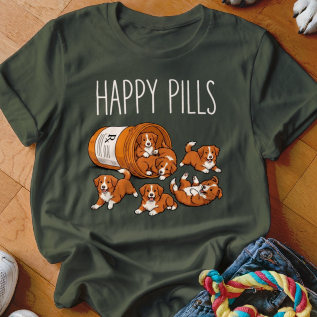 Green t-shirt with "HAPPY PILLS" text and cartoon puppies spilling from a prescription bottle.