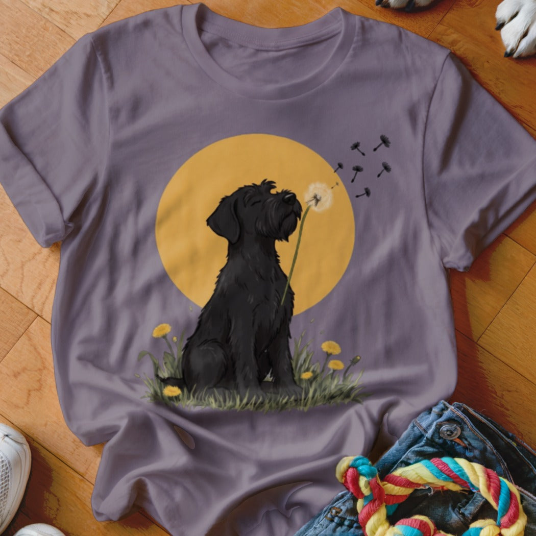 A purple t-shirt featuring an illustration of a black dog blowing dandelion seeds against a yellow circle background.