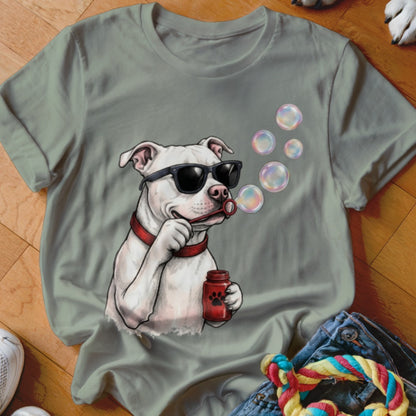 Sage green t-shirt featuring a graphic of a white pit bull wearing sunglasses and blowing soap bubbles.
