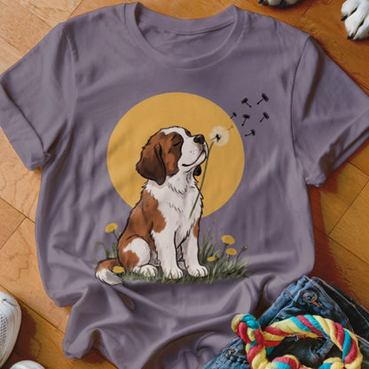 A purple crewneck t-shirt featuring an illustration of a brown and white dog blowing a dandelion.