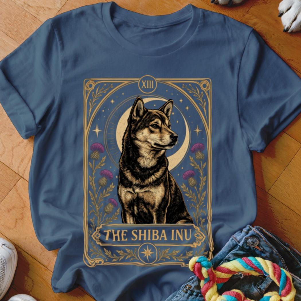 A blue crewneck t-shirt featuring a tarot-style graphic of a Shiba Inu with purple flowers and a crescent moon.