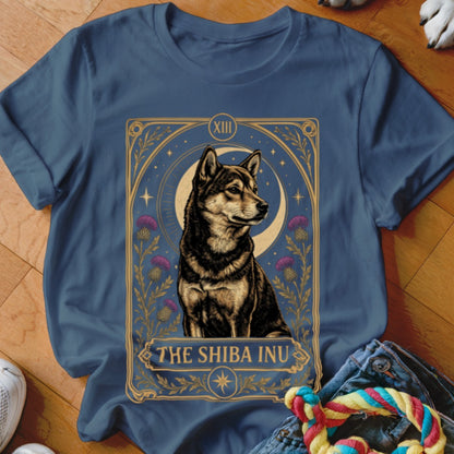 A blue crewneck t-shirt featuring a tarot-style graphic of a Shiba Inu with purple flowers and a crescent moon.