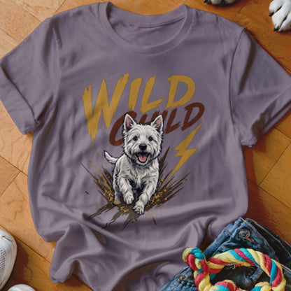 Purple t-shirt featuring a West Highland White Terrier running through mud and text reading WILD CHILD.