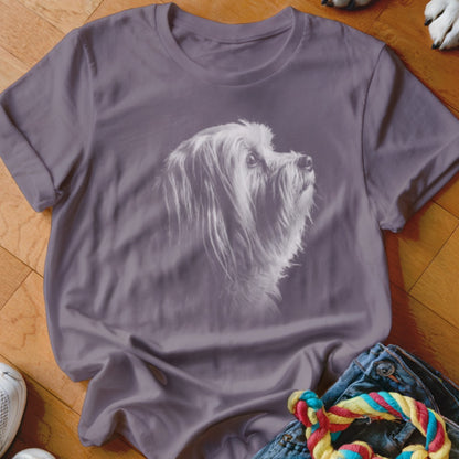 T-shirt with a white sketch of a shaggy dog looking upwards on a purple background.