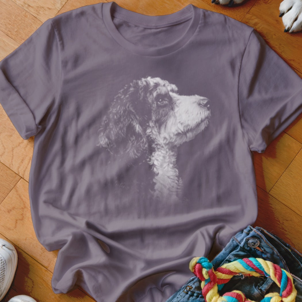 Purple t-shirt with a printed outline of a poodle looking to the right.