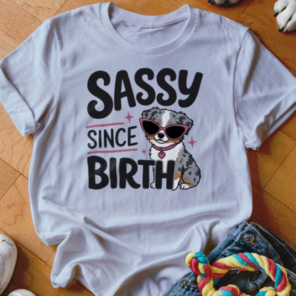 White t-shirt with "Sassy Since Birth" text and a dog wearing sunglasses.