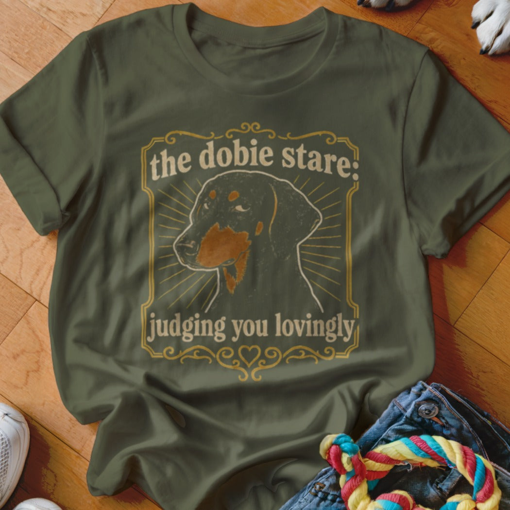 Dachshund graphic t-shirt with text "the dobie stare: judging you lovingly".