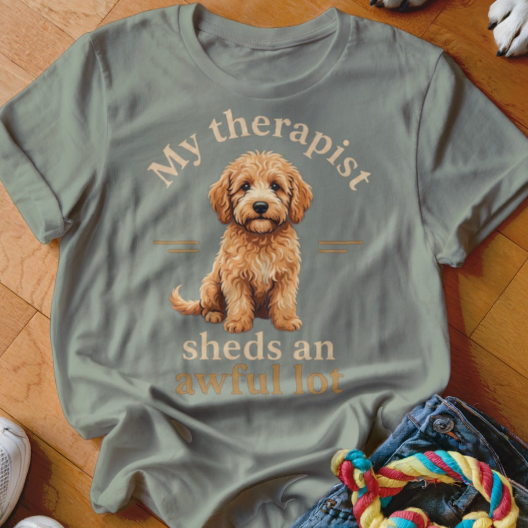 T-shirt with a doodle dog graphic and text "My therapist sheds an awful lot."