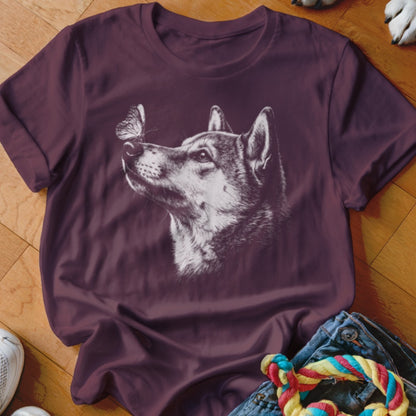 Maroon crewneck t-shirt featuring a white line art graphic of a dog looking at a butterfly on its nose.