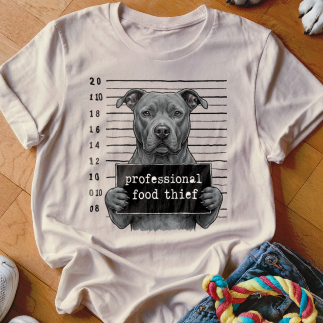 Pit bull dog mugshot graphic with "professional food thief" sign on a t-shirt.