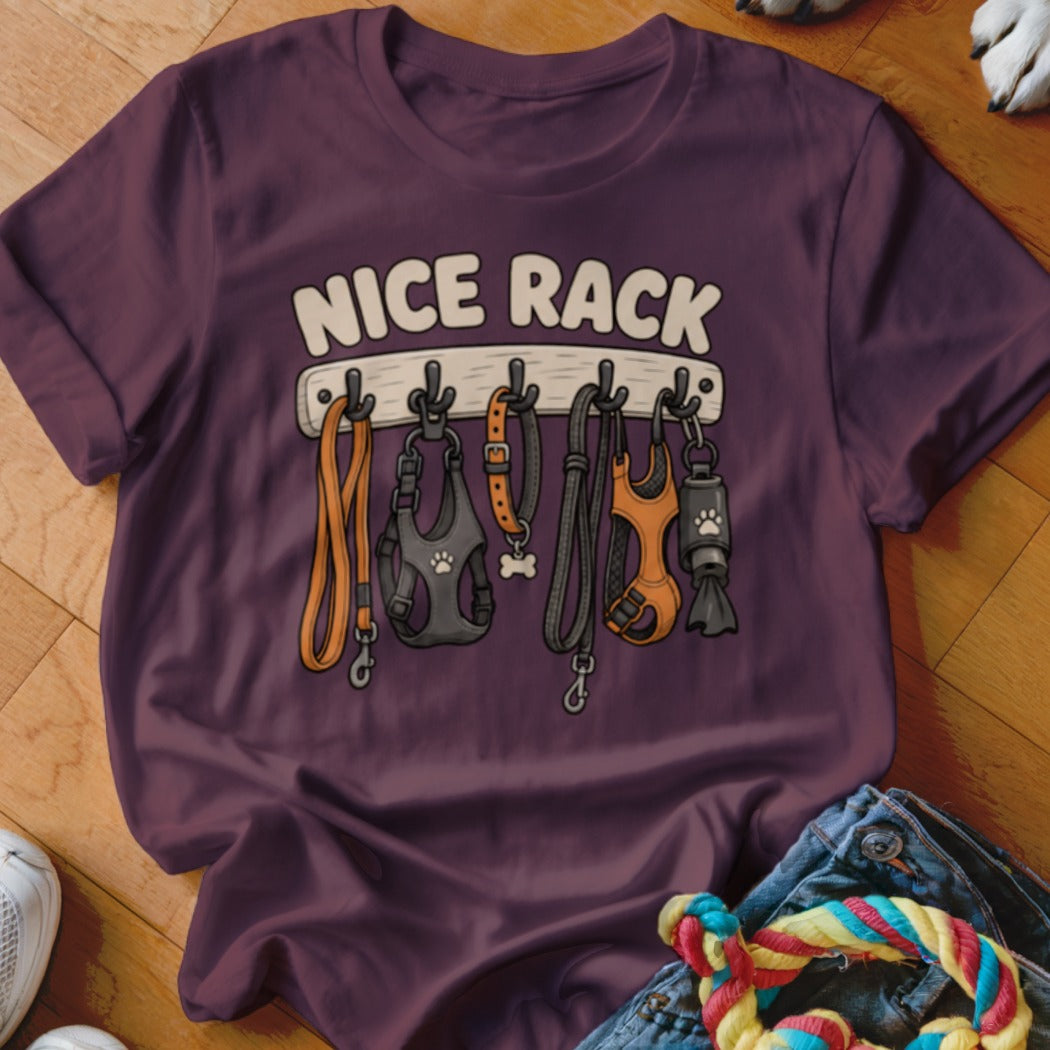 T-shirt with "NICE RACK" text and cartoon dog leashes and harnesses hanging on a rack.