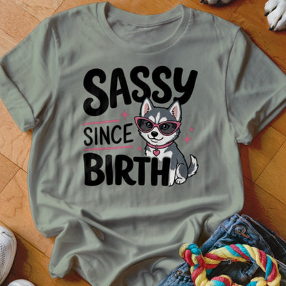 Grey t-shirt with "SASSY SINCE BIRTH" text and a husky puppy wearing sunglasses.