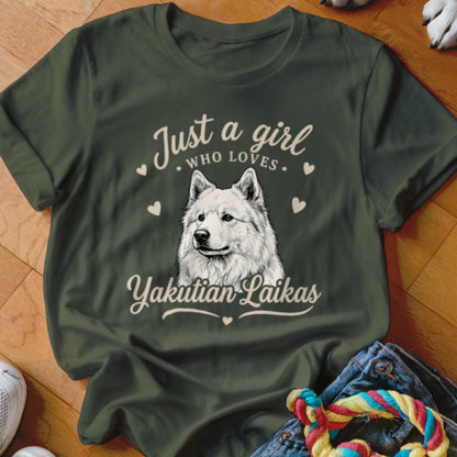 Dark green t-shirt with white text reading "Just a girl who loves Yakutian Laikas" surrounding a dog illustration.