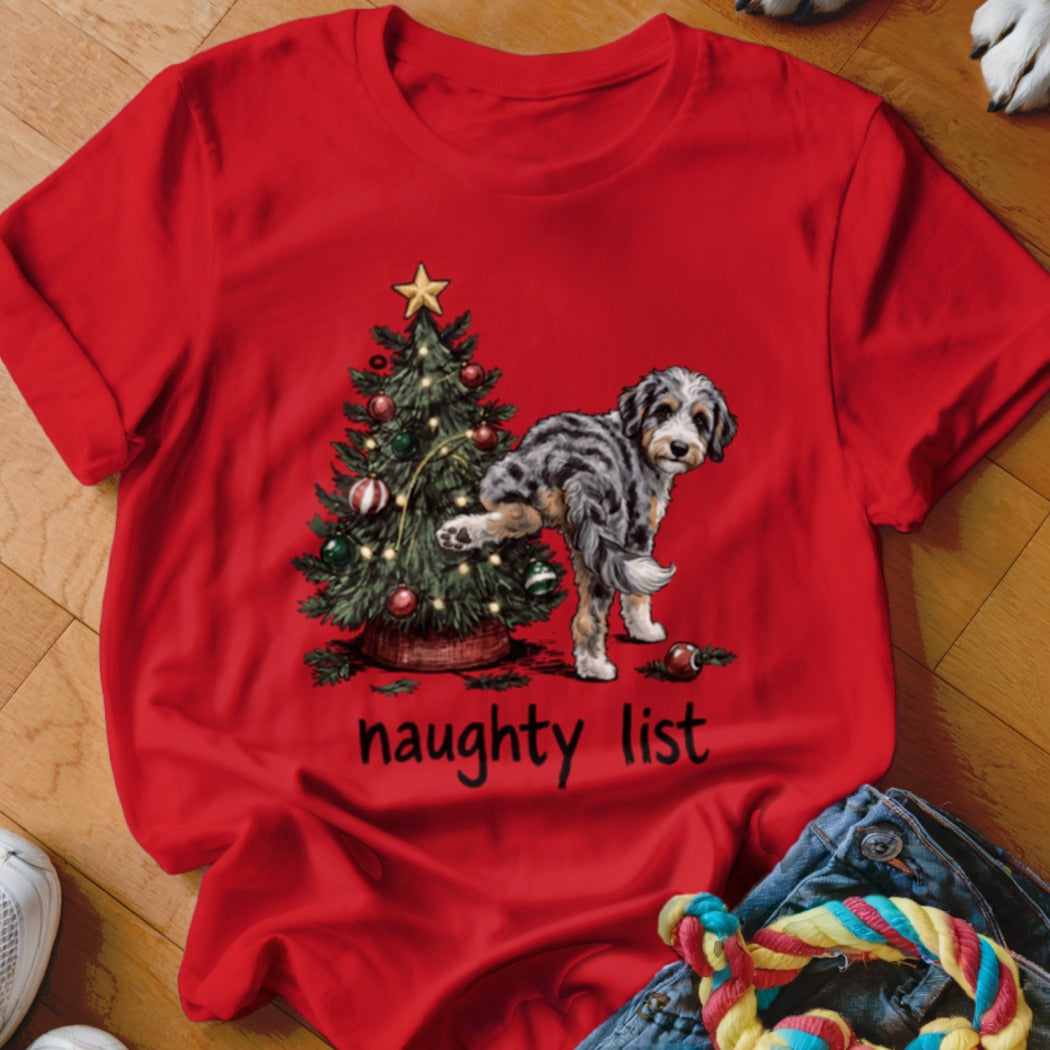 A dog pees on a Christmas tree, with "naughty list" text.