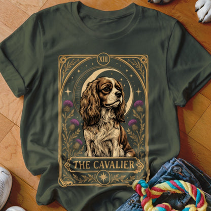 Dark green t-shirt featuring a tarot card style graphic of a Cavalier King Charles Spaniel with text reading THE CAVALIER.