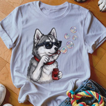 White t-shirt featuring an illustration of a husky wearing sunglasses and blowing soap bubbles.