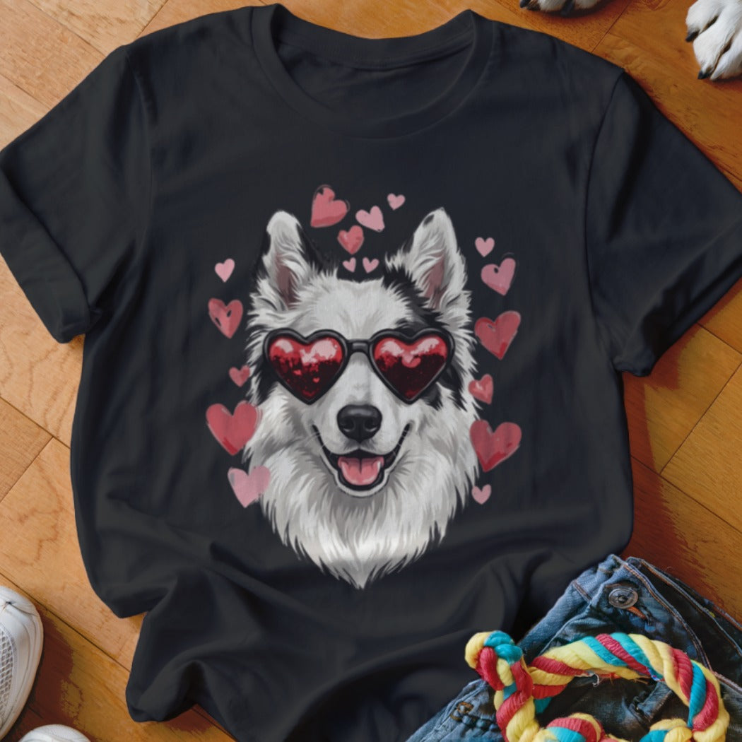 Black short-sleeve t-shirt featuring a graphic of a white dog wearing heart-shaped sunglasses, surrounded by pink hearts.