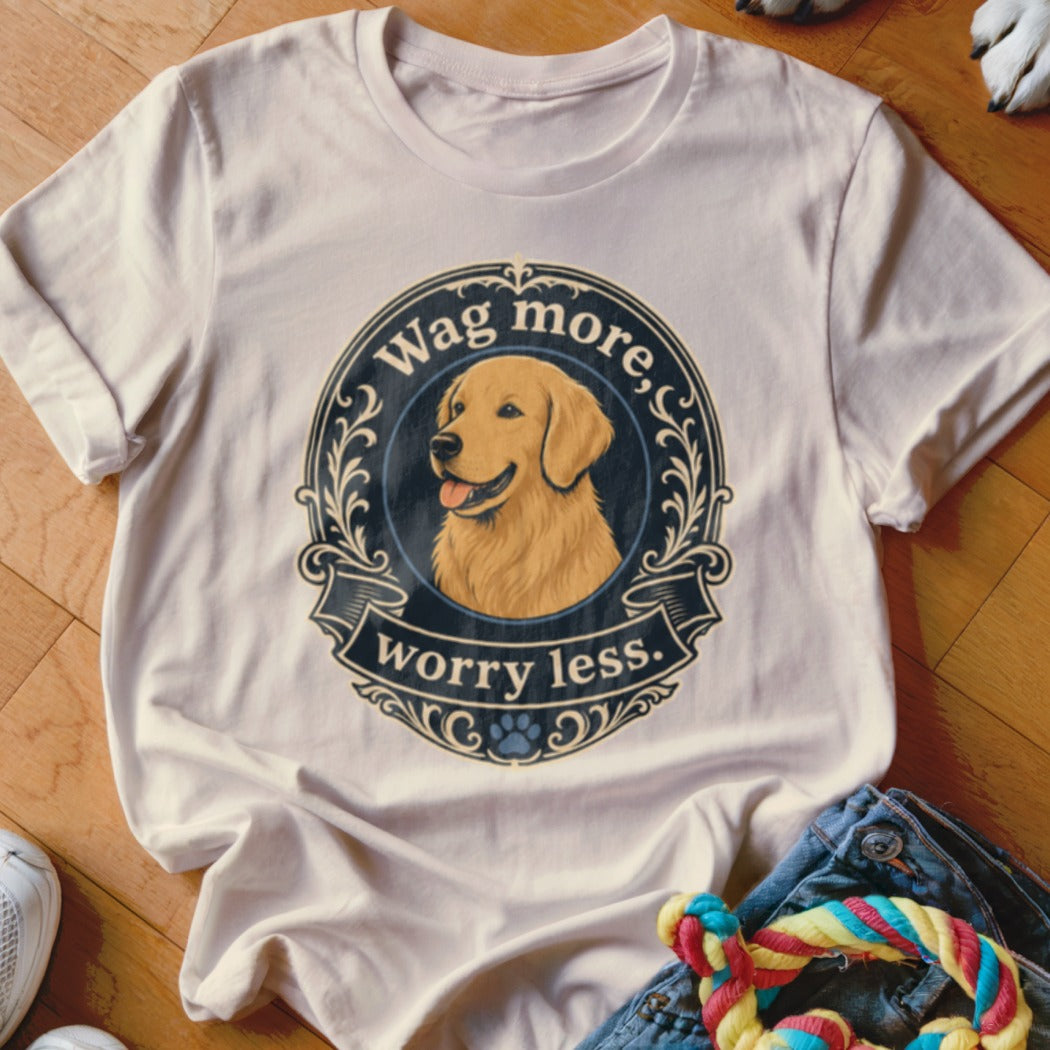White t-shirt with golden retriever graphic and text "Wag more, worry less."