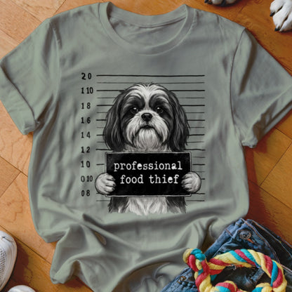 Shih Tzu mugshot with "professional food thief" sign and height markers.