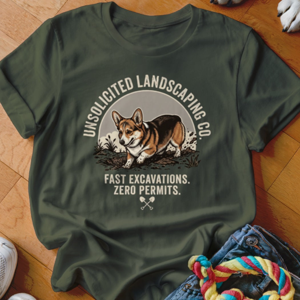 Green t-shirt with a corgi digging, saying "Unsolicited Landscaping Co."