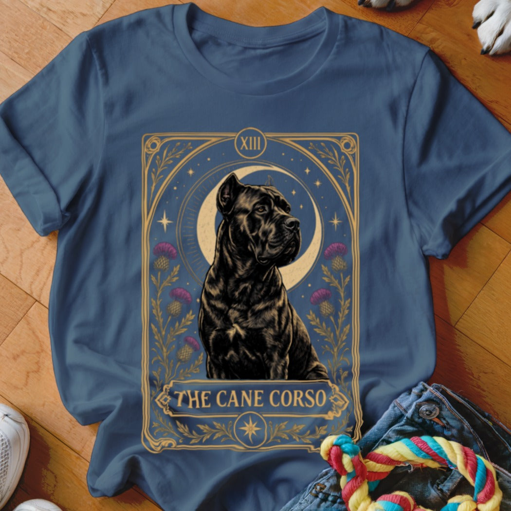A blue t-shirt features a tarot-style graphic of a black Cane Corso dog with the text "The Cane Corso."