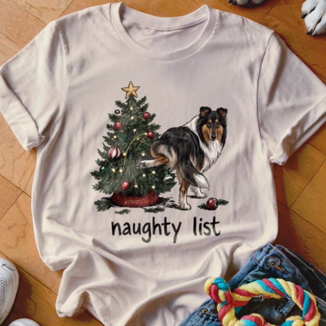 Collie dog lifting leg on Christmas tree with "naughty list" text.