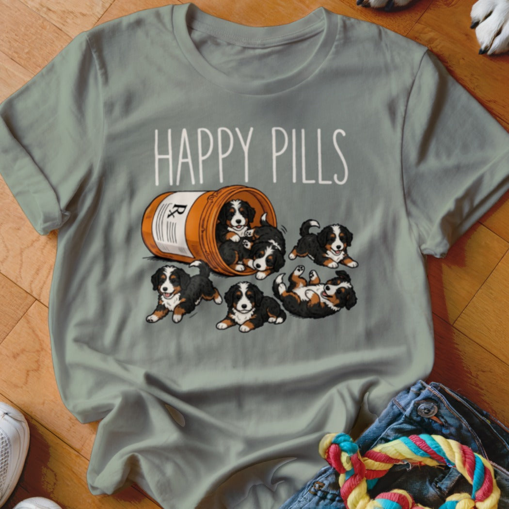 "Happy Pills" text above cartoon Bernese Mountain Dog puppies spilling from a pill bottle.