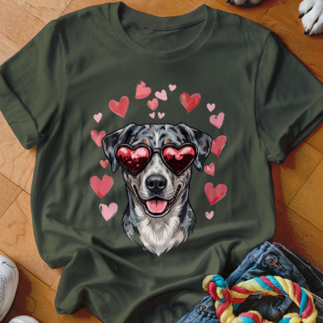 Dark green t-shirt featuring a graphic of a dog wearing heart-shaped sunglasses surrounded by pink hearts.