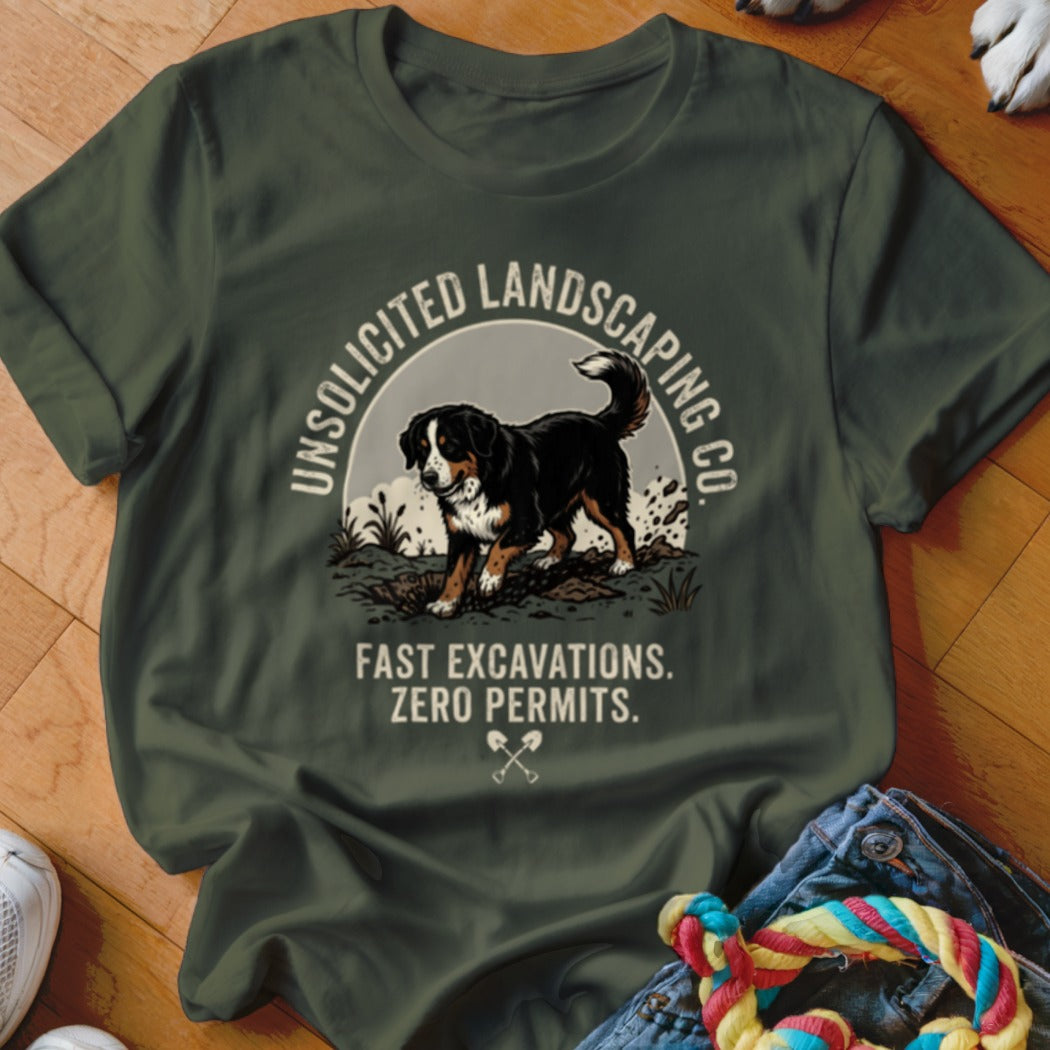 Bernese Mountain Dog on olive green shirt with text "UNSOLICITED LANDSCAPING CO." and "FAST EXCAVATIONS. ZERO PERMITS."