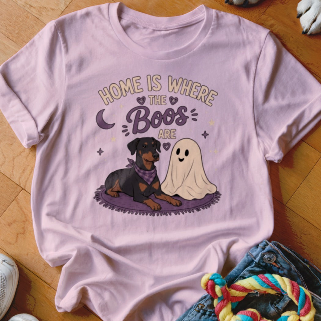 Pink t-shirt graphic of a Doberman and a ghost with text "HOME IS WHERE THE BOOS ARE".