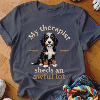 T-shirt with "My therapist sheds an awful lot" text and Bernese Mountain Dog puppy.