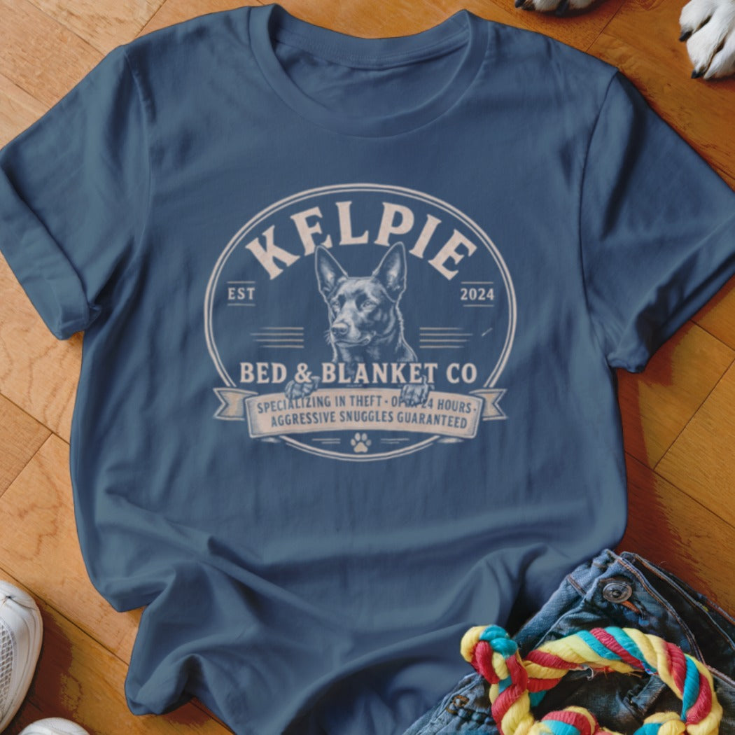 Kelpie Bed & Blanket Co. t-shirt with dog, specializing in theft and 24-hour snuggles.