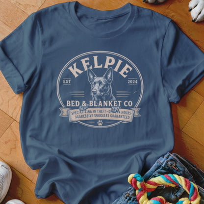 Kelpie Bed & Blanket Co. t-shirt with dog, specializing in theft and 24-hour snuggles.