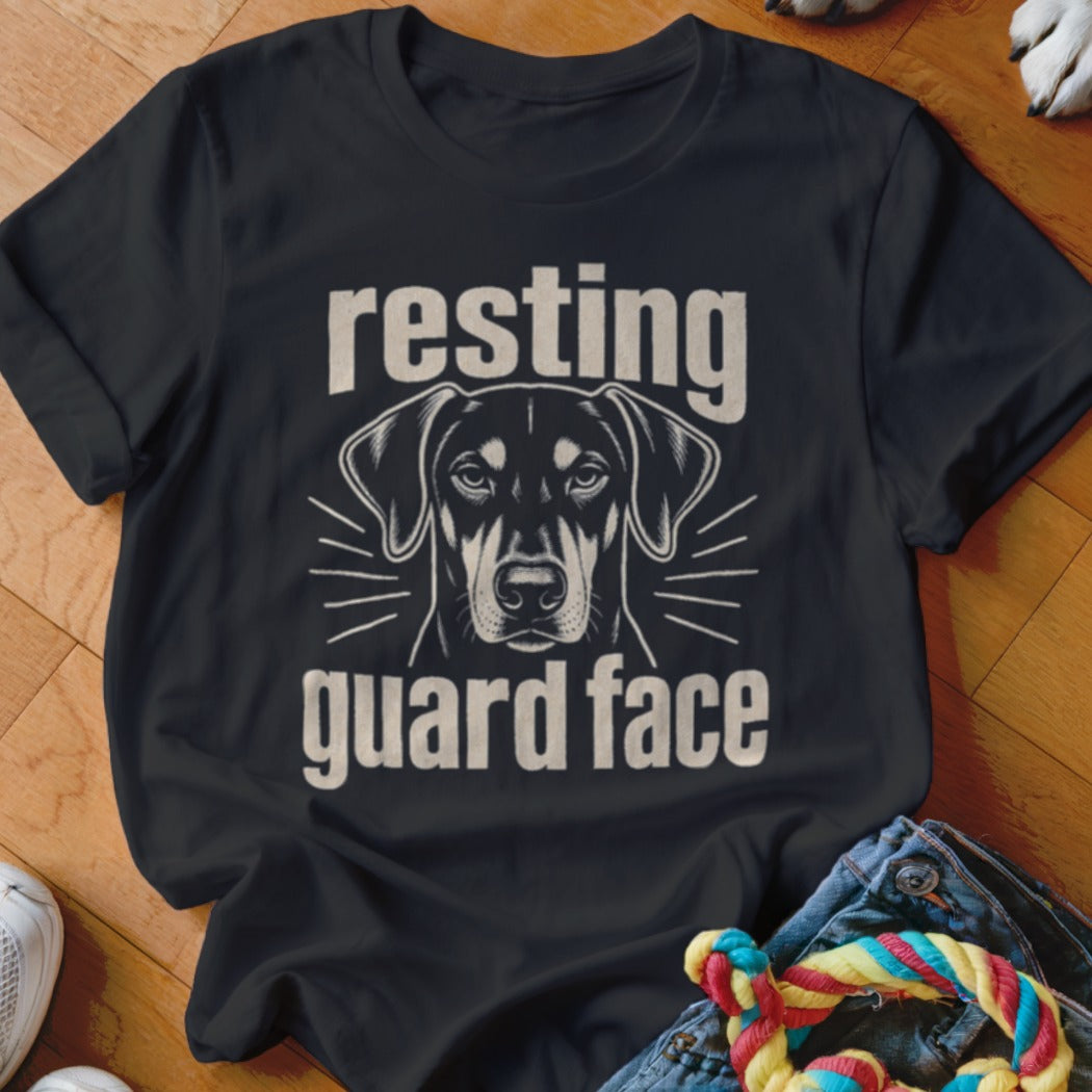 Black t-shirt with a dog's face and text "resting guard face".
