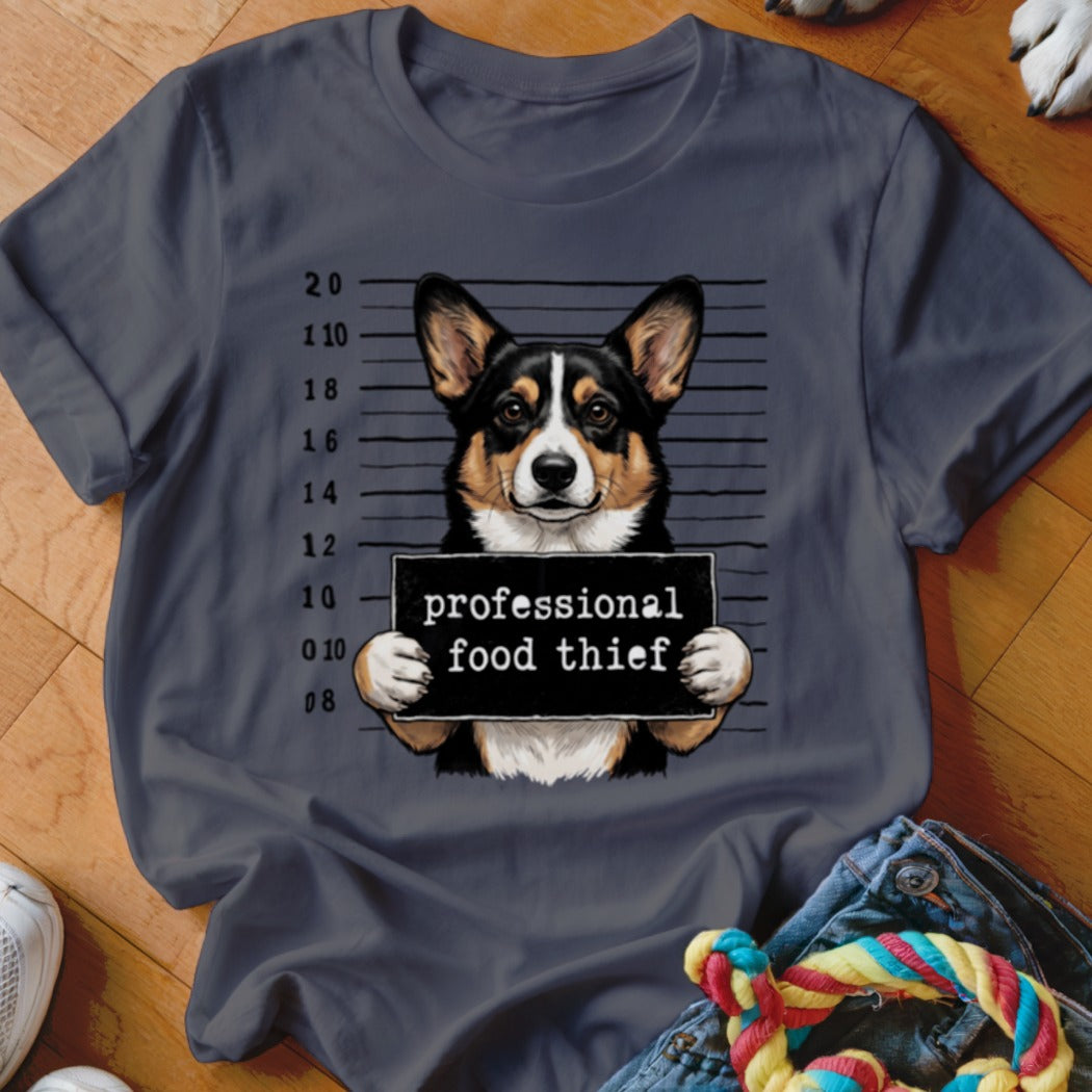 T-shirt with a corgi dog mugshot holding a "professional food thief" sign.