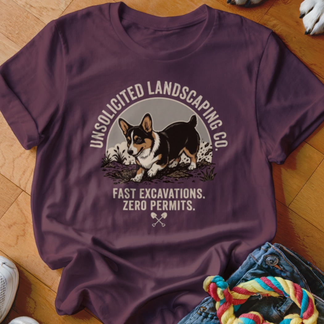 T-shirt with a corgi and text "UNSOLICITED LANDSCAPING CO. FAST EXCAVATIONS. ZERO PERMITS."