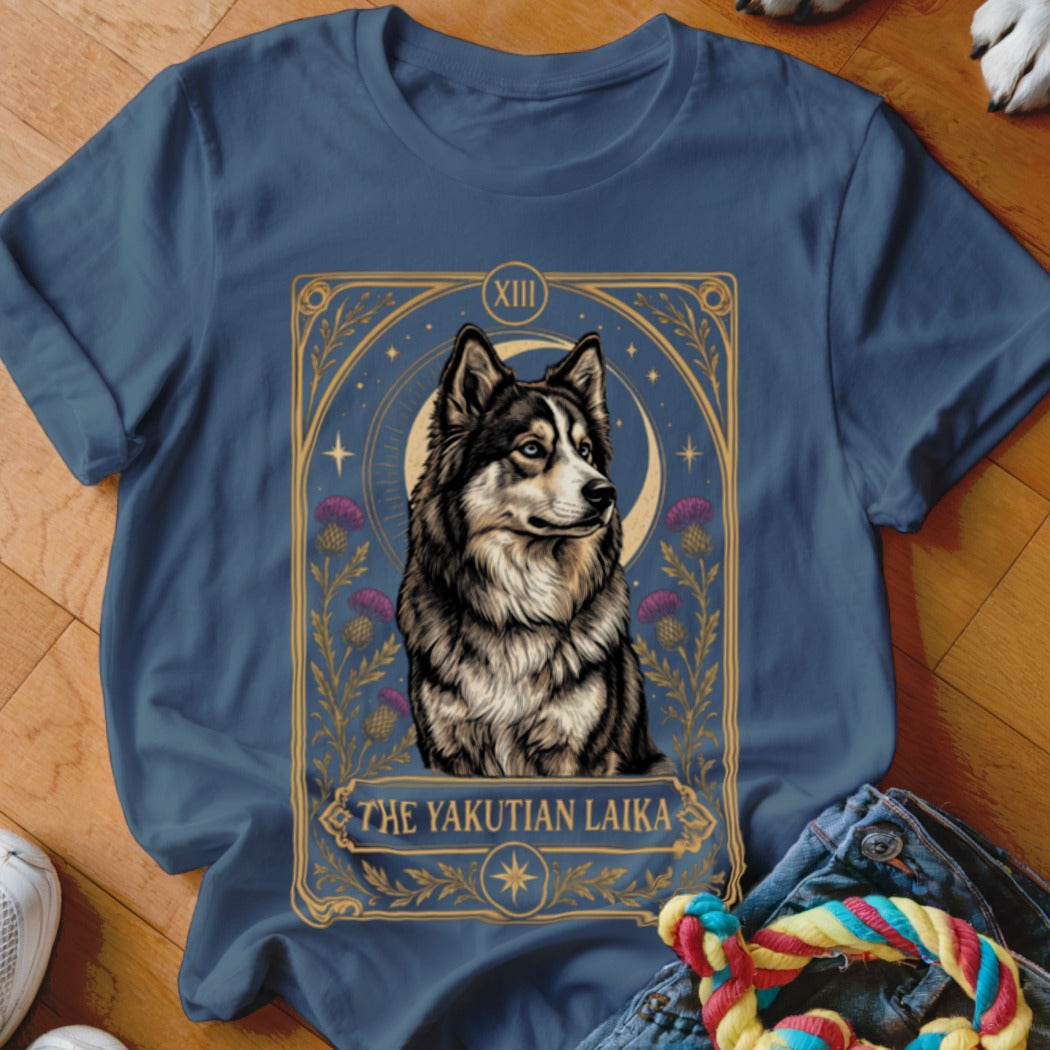 A dark blue t-shirt featuring a tarot card graphic of a Yakutian Laika dog.