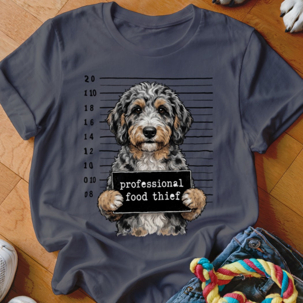 Dog in mugshot holding "professional food thief" sign