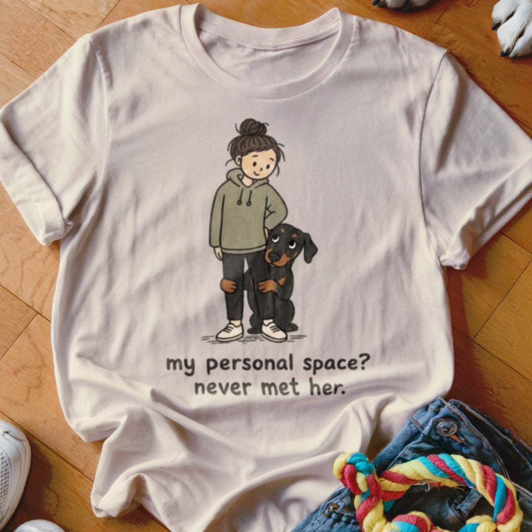 White t-shirt with illustration of girl and dog, text reads "my personal space? never met her."