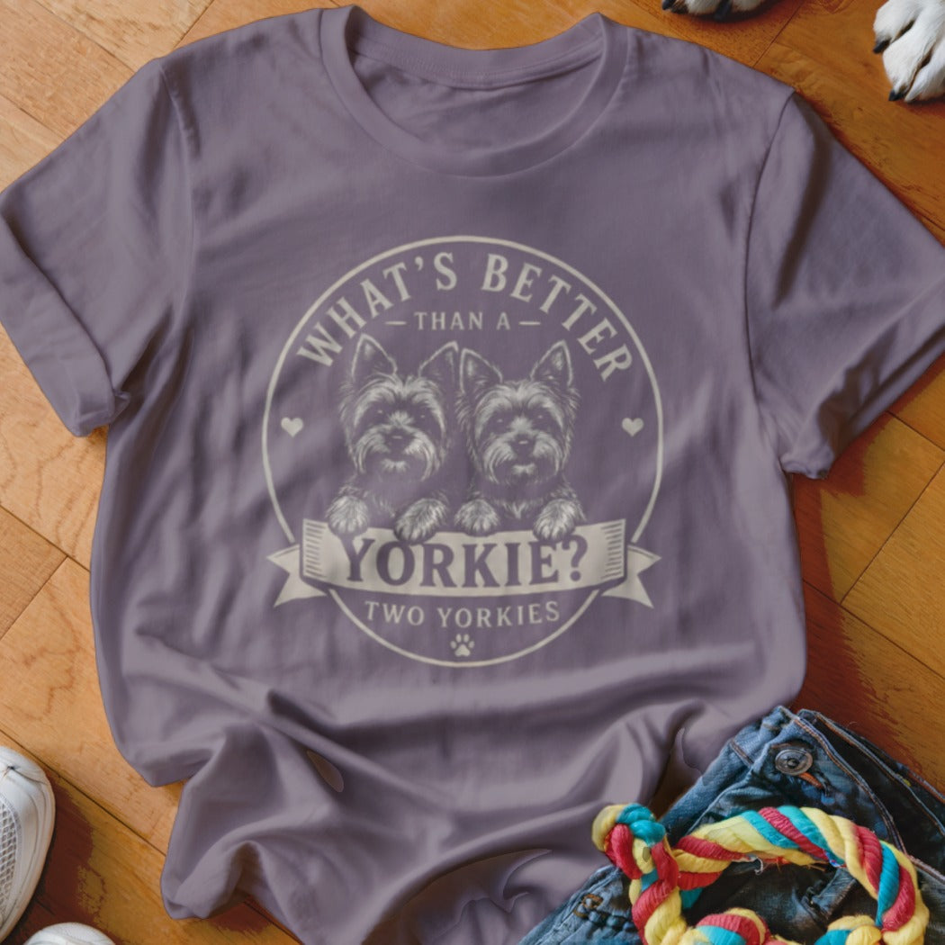 Purple t-shirt with two Yorkshire terriers and text "What's better than a Yorkie? Two Yorkies".