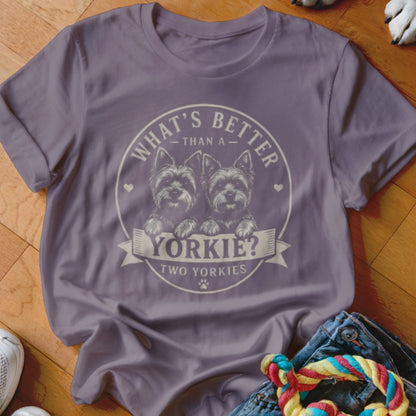Purple t-shirt with two Yorkshire terriers and text "What's better than a Yorkie? Two Yorkies".