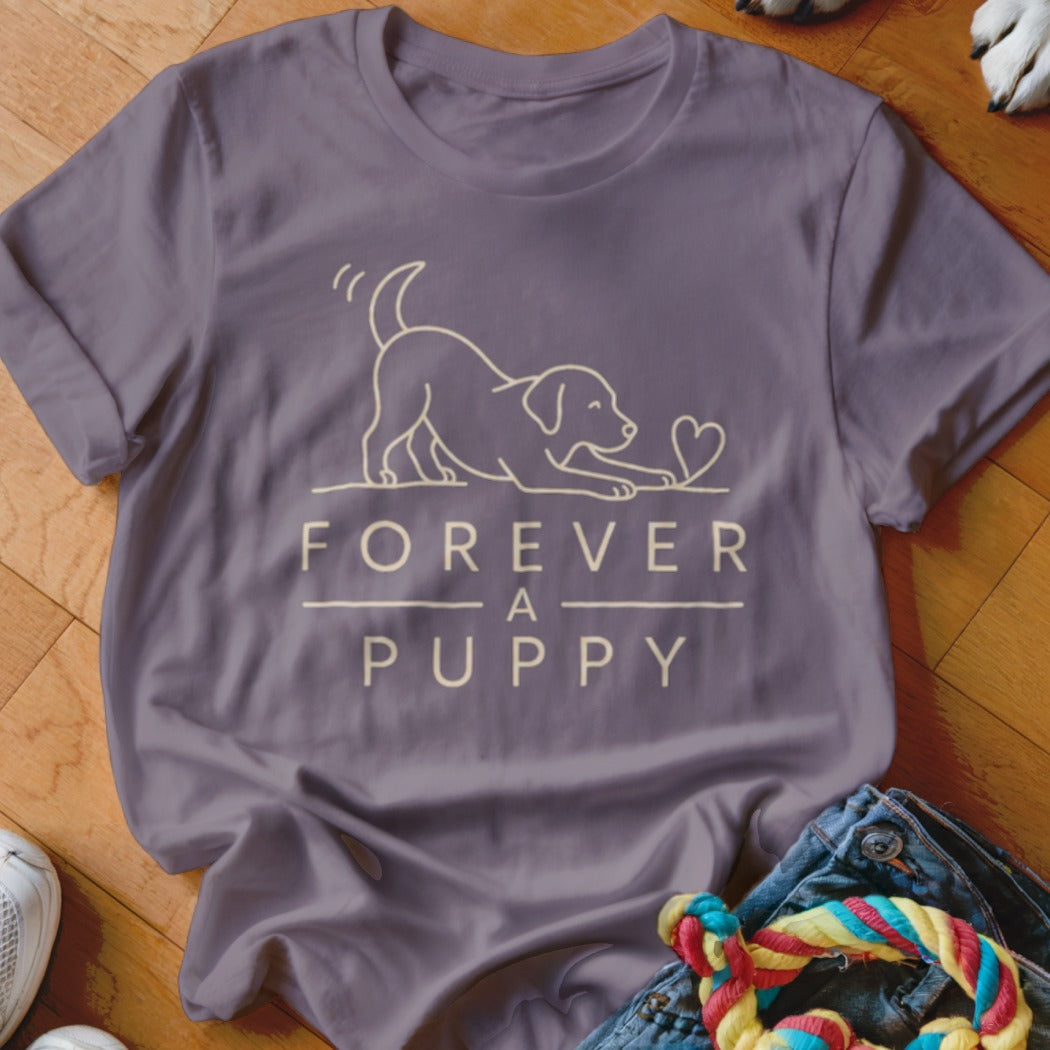 Purple t-shirt with a line drawing of a puppy and the text "FOREVER A PUPPY".