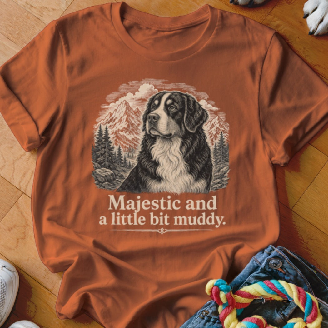 Orange t-shirt featuring a Bernese Mountain Dog in a mountain landscape with text.